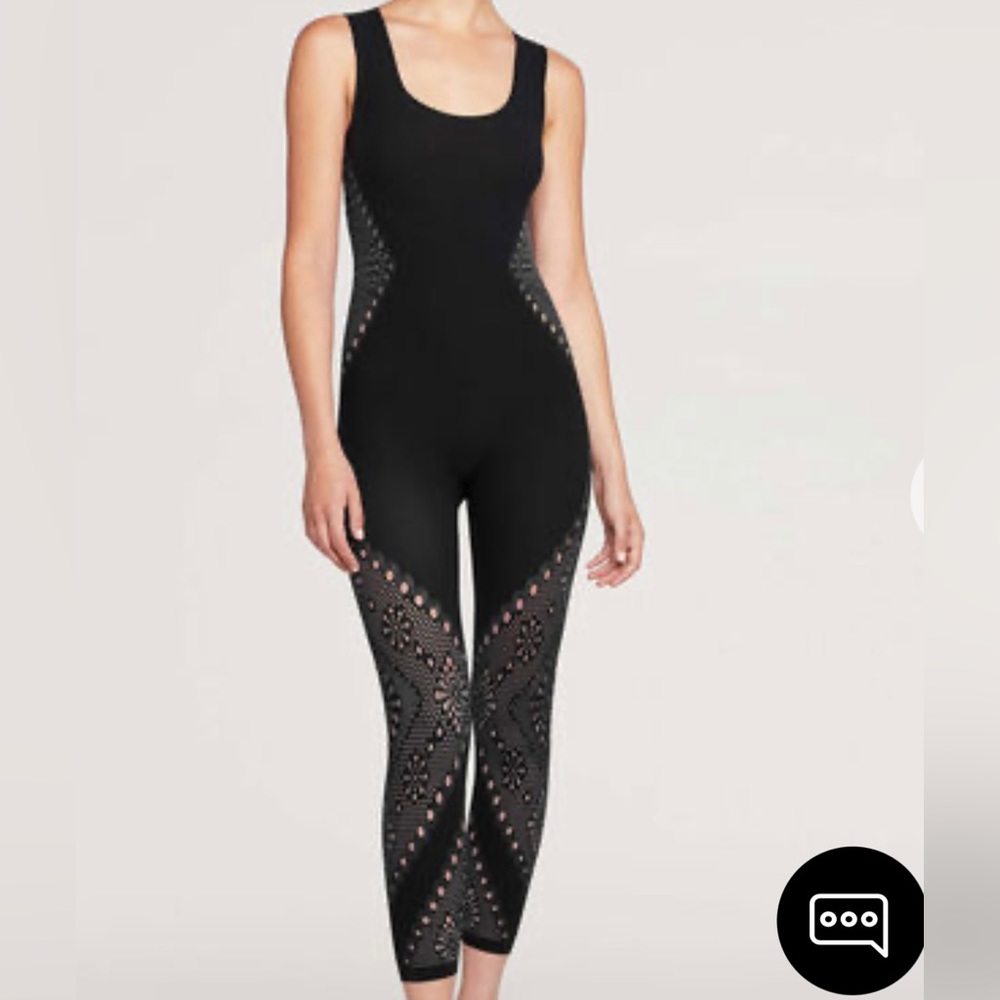 Nice fitted jumpsuit. Worn twice. Excellent condition. No damage. Like new.